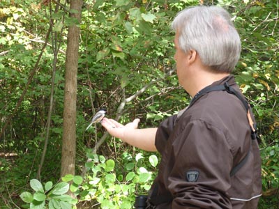 Dave feeding Chickadee